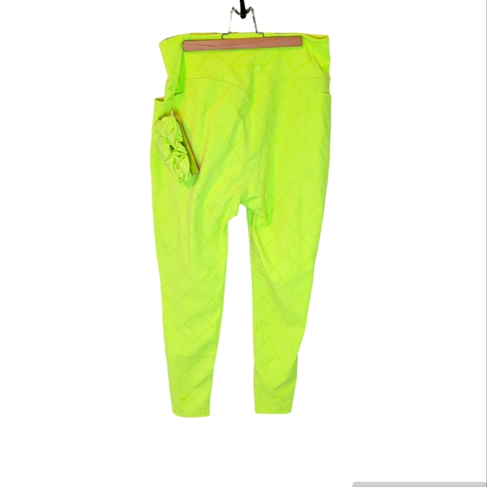 SHEFIT neon yellow workout jogger pants.